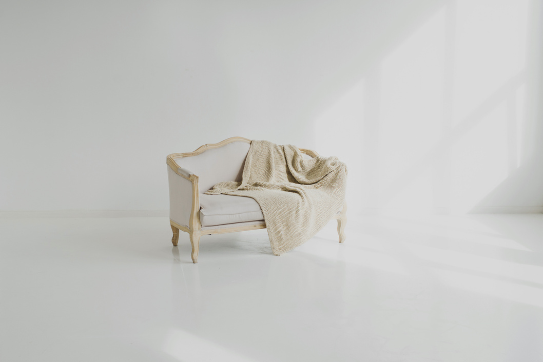 White Towel on White Wooden Sofa